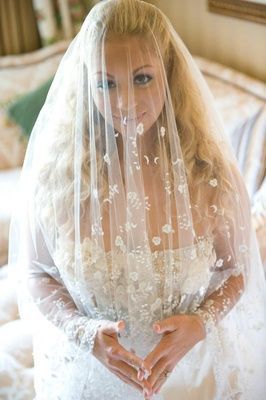 bride with veil over face: 