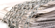 newspapers-chained-1280x720-istockphoto