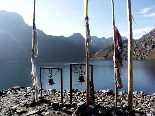 Prayer flags and ceremonial bells beside the shores of Gosainkund