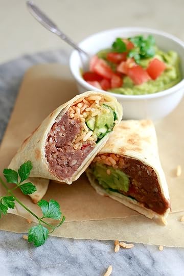 Healthy make ahead bean and rice burritos are perfect for easy vegetarian packed lunches. Find out how meal prep and freeze burritos.