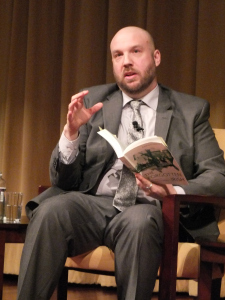 Reading some extracts from the book to add to the discussion (Photo © Bruce Guthrie)