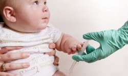 Baby was receiving his scheduled vaccine injection in his right thigh muscle ie intramuscular injection public domain image is in public domain. (http://www.public-domain-image.com/)