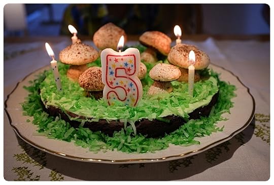 Meringue Mushroom birthday cake with coconut flake grass
