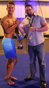 layne norton presenting kyle russell with the trophy at the UKDFBA Layne Norton Classic.