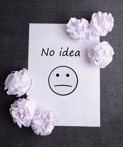 Sheet of white paper with crumpled paper and pencil on table close-up