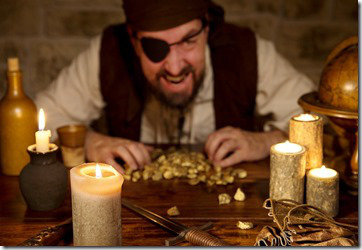 Pirate With A Treasure Of Gold Behind A Lot Of Candles