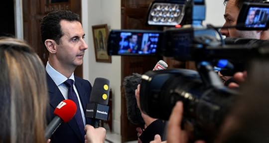 Syria's President Bashar al-Assad speaks to French journalists in Damascus, Syria, in this handout picture provided by SANA on January 9, 2017
