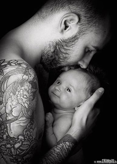 tatooed man with baby: 
