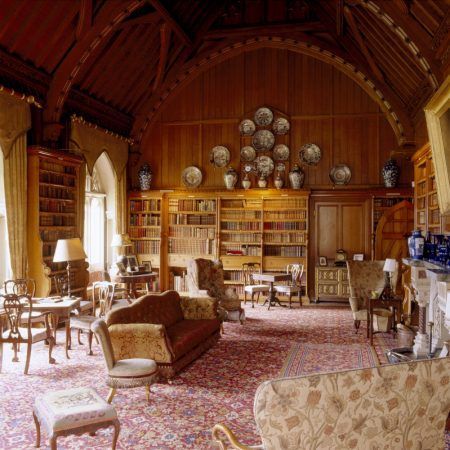 The library at Tyntesfield, a Victorian Gothic Revival estate in Somerset, England. The library contains one of the largest collections of Victorian books in England.: 