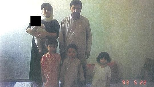 A photo apparently taken in Pakistan in May 1993, showing Mohammad Shafia and Tooba holding an infant (Mina*), with children Zainab (from left), Hamed and Sahar in front. Mina's face is obscured to protect her identity, in compliance with a court order. (from Supreme Court of Canada file)