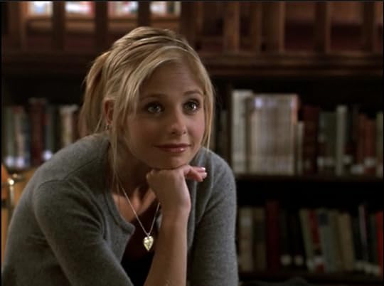 Buffy has her chin propped on her hand and she's looking at Wesley with a smug little 