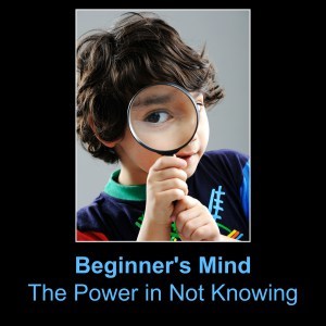 Portrait of child looking closely with magnifying glass