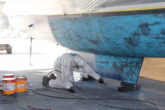 Affordable Antifoul giving the hulls a coat of paint.