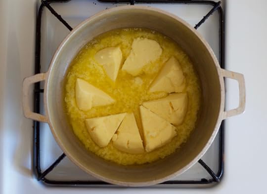 Wedges of butter in a pot, beginning to melt into homemade grassfed ghee
