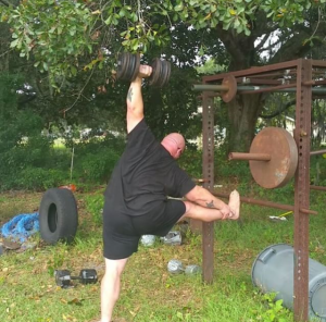 bud jeffries 100 pound one arm dumbbell clean and press in ballet stretch