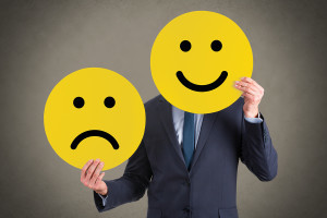 Business Person Unhappy and Happy Smileys Working