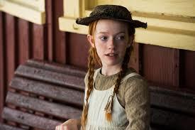 a still image of Anne waiting for Matthew at the train station
