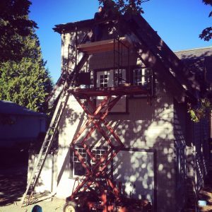 Jim on top of scissor lift prepping trim.