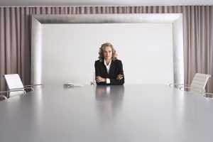 Business Executive Sitting in Boardroom