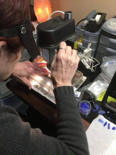 Andrea Sharpe of Karlande Designs drilling glass