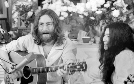This undated photo received 20 May, 2004...This undated photo received 20 May, 2004 shows John Lennon and his wife Yoko Ono at the Queen Elizabeth Hotel in Montreal. During the turmoil of Vietnam war, honeymooners John and Yoko spent one week in a bed at the Queen Elizabeth to promote peace. Thirty-five years later, From 26 May - 02 June, the Queen Elizabeth Hotel is hosting an exhibit of photos by photographer Gerry Deiter, who documented their stay, to commemorate the historic impact of the bed-in. AFP PHOTO/HO/Gerry Deiter/www.elliottlouis.com/Courtesy of Queen Elizabeth hotel. (Photo credit should read GERRY DEITER/AFP/Getty Images)