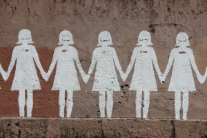 Paper doll graffiti in a public street - Rome