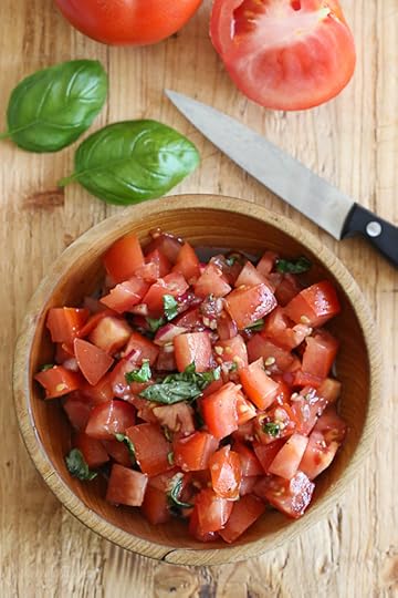 Grilled Chicken Bruschetta is a summer staple in my house! Made with juicy tomatoes, mozzarella, basil, red onion, garlic and balsamic, it turns plain grilled chicken into a delicious weeknight meal in minutes!