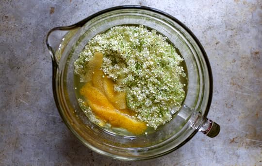 Macerating lemon peel and elderflowers for elderflower cordial