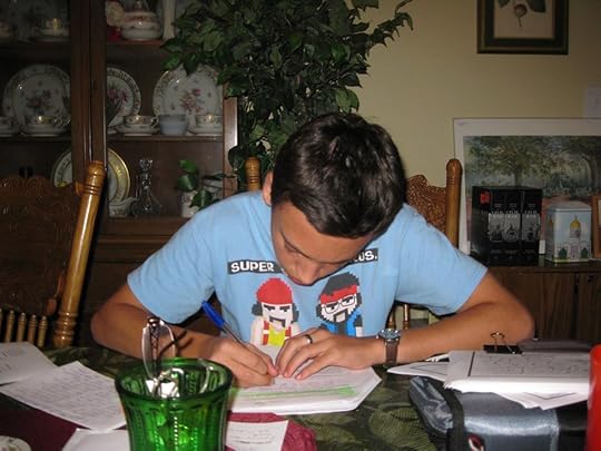 Image may contain: one or more people, people sitting, table, plant and indoor