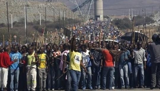 Mineworkers take part in a march at Lonmin