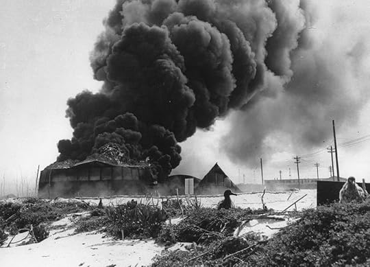 Oil tanks burning on Midway Atoll after Japanese attack, 4 Jun 1942 (US National Archives)