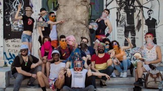 The Lgbtqi+ Refugees in Greece group with the replica of the oath stone of Roger Bernat’s The Place of the Thing,2017.