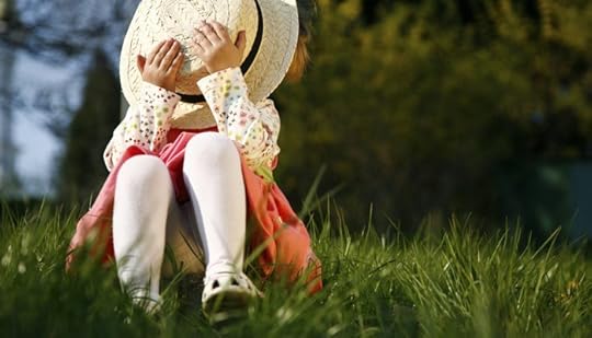 little-girl-hiding-behind-hat