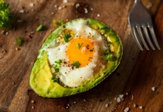 Homemade Organic Egg Baked in Avocado with Salt and Pepper