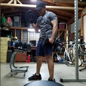 Obstacle course racer Pete Armas trains with weights and bodyweight exercises in his garage gym