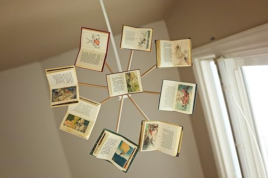Baby mobile with small books hanging from it
