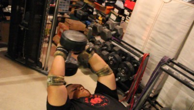 AVR doing dumbbell pullovers in his garage gym
