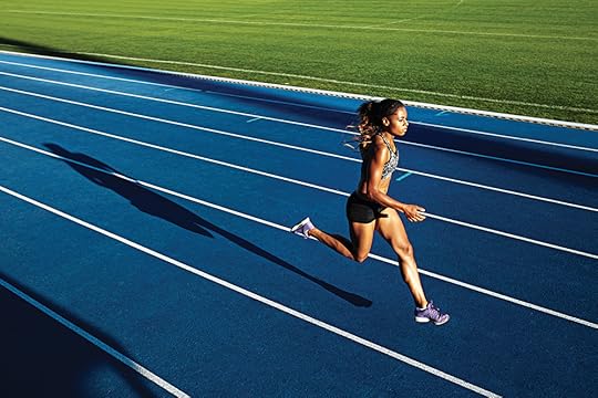African woman running on racetrack