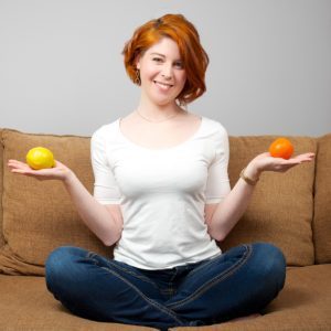 Dr. Laura Nurse Naturopathic Doctor balancing fruit