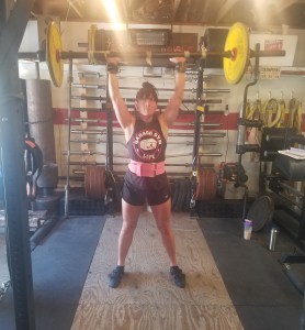 Annie Lori Thompson doing an axle press