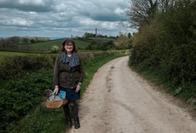 picture of Debbie on winding footpath with the Hawkesbury Monument in the distance