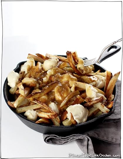 Classic Canadian comfort food: The Ultimate Vegan Poutine. Baked crispy French fries, topped with quick and easy dairy-free cheese curds, smothered in rich onion gravy. #itdoesnttastelikechicken