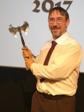 Gav holding Snaga, the trophy for the David Gemmell Legend Award for Fantasy.