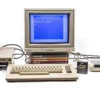 A beige Commodore 64 computer terminal on a white backdrop. The program for 