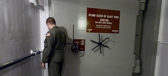 In this photo taken June 24, 2014, 1st Lt. Phil Parentrau opens the first of two blast doors leading to the underground control room at an ICBM launch control facility near Minot, N.D.