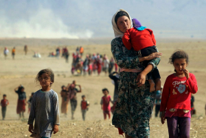 RefugeeYazidisFleeingAugust112014ReutersViaTimeMag