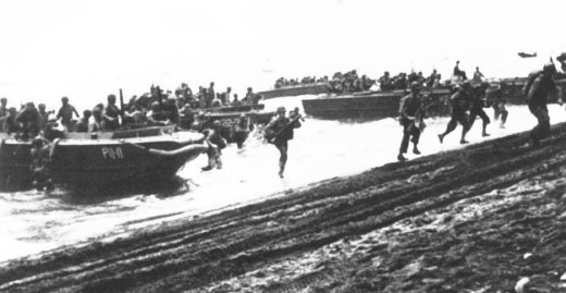 US First Division Marines storm ashore across Guadalcanal's beaches on D-Day, 7 August 1942, from attack transport USS Barnett and attack cargo ship USS Fomalhaut (US National Archives)