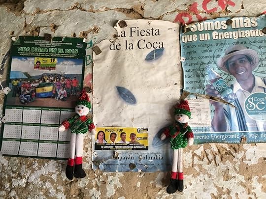 Posters advertising the festival of coca, and a coca-laced beverage in a home outside Lerma