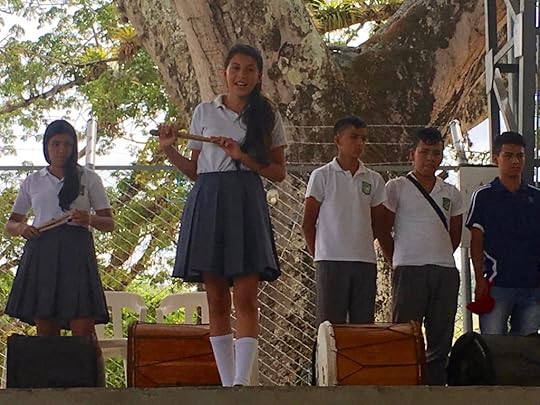 Leader of the school Chirimía ensemble presents her group