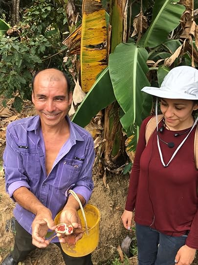 Showing off the achiote harvest.